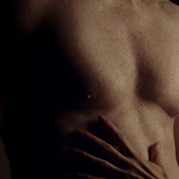 Female hands touching male muscular torso. Slow motion. 1080x1080