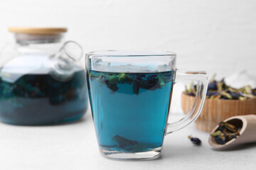 Delicious butterfly pea flower tea on white table