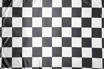 Checkered finish flag as background, top view