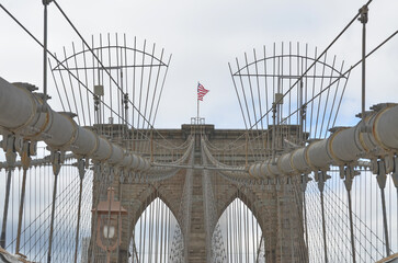 Close-Up of Brooklyn Bridge with American Flag with view to the sky made 2011