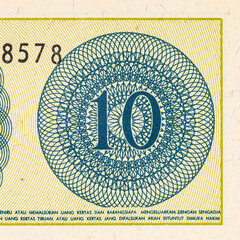 Fragment of a 10 sen banknote of Indonesia, 1964. Indonesian money. © Sergii