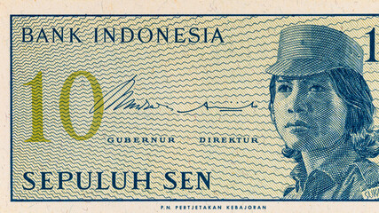 Fragment of a 10 sen banknote of Indonesia, 1964. Indonesian money. © Sergii