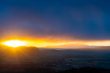 Spectacular sunrise over mountains and landscape
