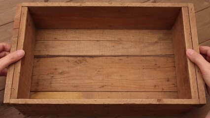 hand holding wooden box