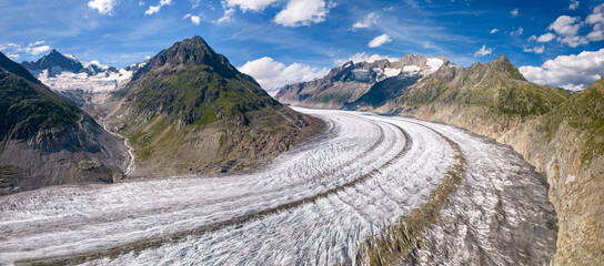 Aerial drone view of Great Aletsch Glacier Alps Switzerland in sunny summer day. Popular tourist destination