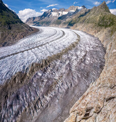Aerial drone view of Great Aletsch Glacier Alps Switzerland in sunny summer day. Popular tourist destination