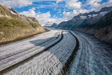 Aerial drone view of Great Aletsch Glacier Alps Switzerland in sunny summer day. Popular tourist destination