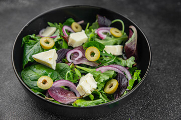 Salad with olives, cheese and green leaves fresh delicious gourmet food background on the table rustic food top view copy space keto and paleo diet vegetarian  food