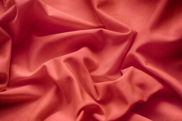 A rose crumpled fabric texture background. Close up.