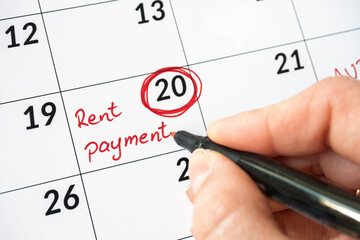 cropped image of handwritten Rent Payment Due Date In Calendar. Close up of rent payment written on...
