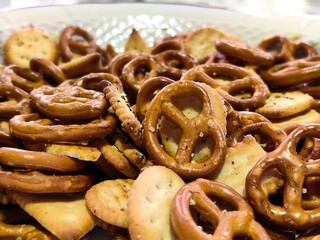 Crackers and Pretzels. Mixed salty snack for party. Appetizer salted biscuit