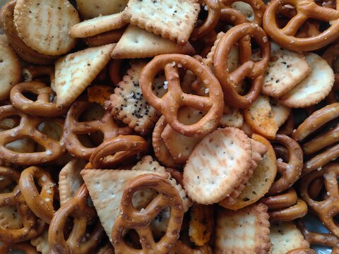 Crackers and Pretzels. Mixed salty snack for party. Appetizer salted biscuit