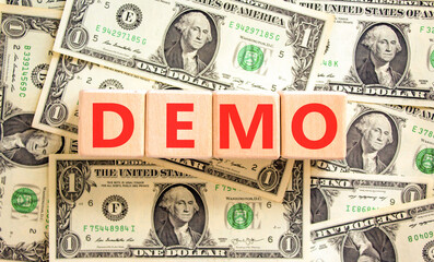Demo symbol. Concept word Demo on beautiful wooden blocks. Dollar bills. Beautiful background from...
