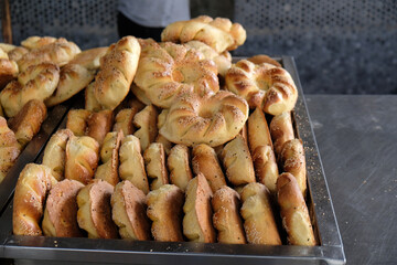 traditional uzbek flatbreads from tandoor on metal tray close-up, Uzbekistan