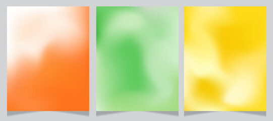 Obraz premium Set of three abstract gradient backgrounds with soft, blurred textures. Features warm orange and white, fresh green, and vibrant yellow tones. Ideal for modern designs, branding, and creative projects