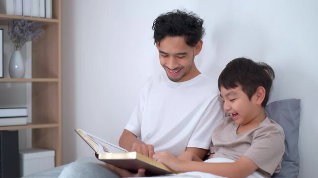 Asian man let his son learn about the holy koran.