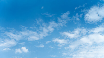The sky is a vibrant, cloudless blue, while the sun shines brightly, making it appear even more radiant.