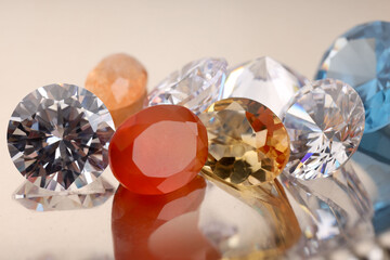 Beautiful shiny colorful gemstones on light background, closeup