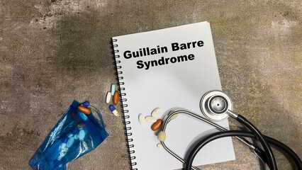 Concept of Guillain Barre Syndrome write on book isolated on Wooden Table.
