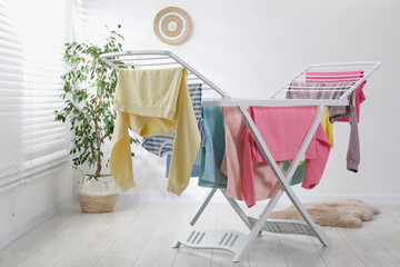 Drying rack with fresh clean laundry at home