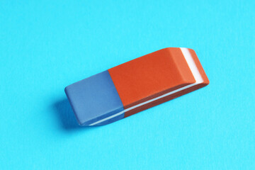 One eraser on light blue background, above view