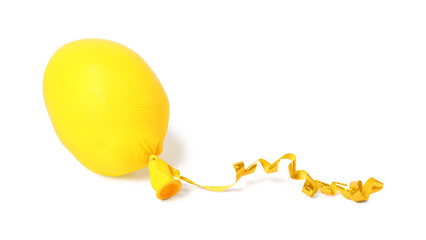 One yellow half deflated balloon isolated on white