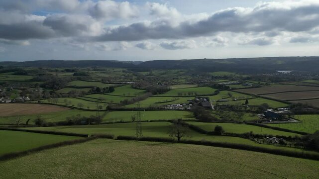 Aish, Torbay, South Devon, England: DRONE VIEWS: The drone flies over hilltop farmland heading towards Stoke Gabriel. South Devon is a popular UK holiday destination.