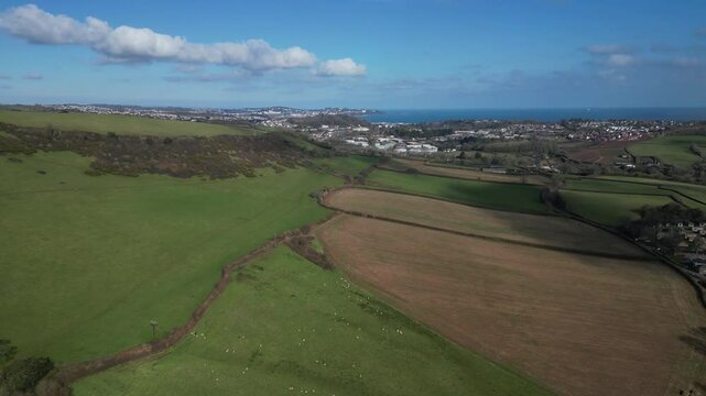 Aish, Torbay, South Devon, England: DRONE VIEWS: Looking over farmland towards the sea of Torbay and the coastline. South Devon is a popular UK holiday destination (Clip 2).