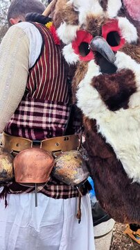 Kukeri costumes and masks with bells in the clothing, dedicated to the annual Kukeri folklore festival in Bulgaria
