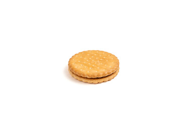 A single cookie with a chocolate filling. The cookie is on a white background