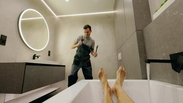 Playful plumber dancing energetically in a modern bathroom while a man relaxes in the bathtub, humorously performing a private dance.