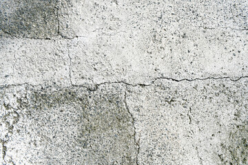 Dirty old cracked concrete mixed with small gravel stone texture background. Grunge and rough surface.