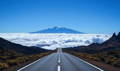 A wide highway with white lines leading to the horizon, with a blue sky and clouds in the background
