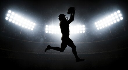 Obraz premium American Football Player Silhouette - Silhouette of an American football player making a spectacular catch under stadium lights. Dramatic and powerful