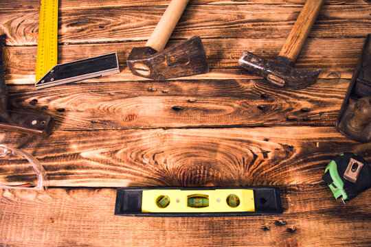 carpenter tools on wood table background