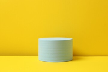 Blue podium on a yellow background