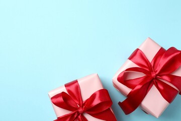 Beautiful gift boxes on color background