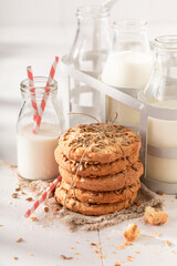 Crunchy sunflower seed cookies served with milk in bottle.