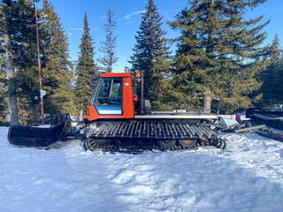 snowmobile on snow in winter forest