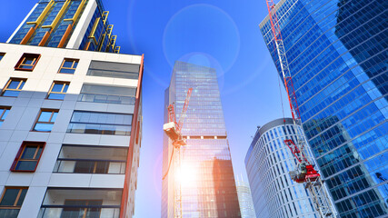 Fototapeta premium View of an modern apartment building standing next to a new modern office building with a glass facade.