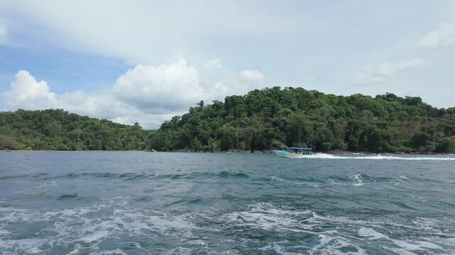 Slow motion ferry shuttle boat on Pacific Coast in Costa Rica