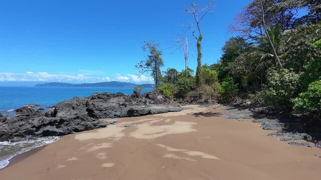 Drone shot flying backwards on Drake's Bay Trail revealing beautiful beach cove