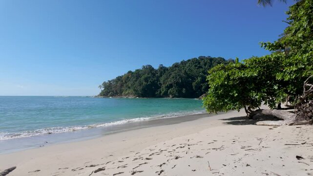 Beautiful Pacific Coast Beach Manuel Antonio in Costa Rica. Blue skies, turquoise ocean and white sand, deserted paradise beach. 