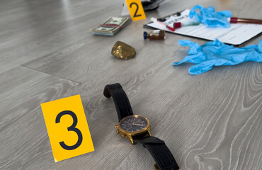 Fototapeta premium Evidences and crime scene markers on light grey marble background, flat lay