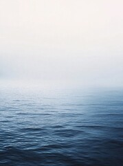 Obraz premium Abstract watercolor painting of blue sea horizon on textured paper, minimalist ocean landscape, artistic gradient, soft ink wash effect