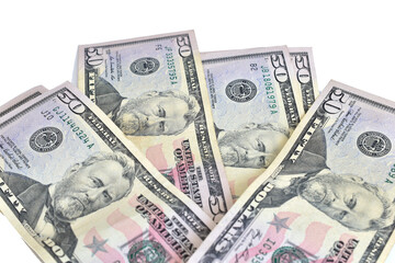 American 50 dollar bills lie on a white background.