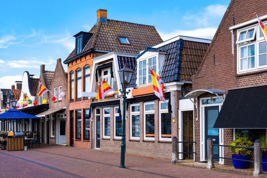 A picturesque street in Lemmer with traditional Dutch architecture and festive decorations