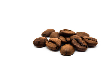 Spilled coffee beans on a white background