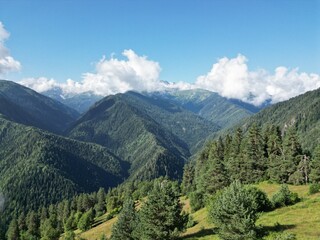 Fototapeta premium Clear blue sky over serene mountain landscape