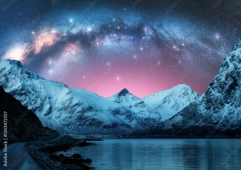 Wall mural milky way arch above fjord and snowy mountains on starry winter night. lofoten islands, norway. pano